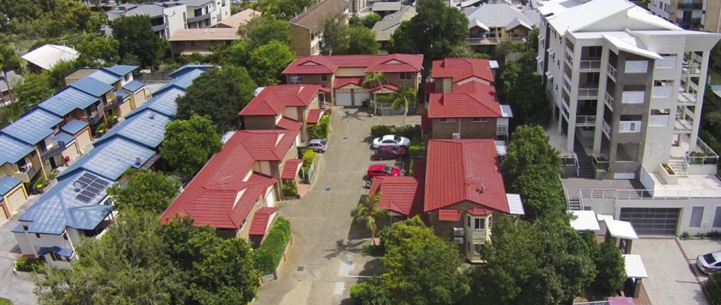 A family has sold a development site in Indooroopilly after acquiring nine townhouses over 20 years.
