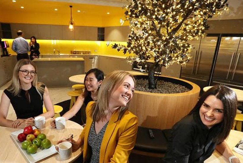 Thynne + McCartney legal practitioners Penny Loel, Bonita Wong, Jessica Carroll and Rebecca Flynn under the ‘Tree of Knowledge’ in the lunch room. Picture: Lyndon Mechielsen.
