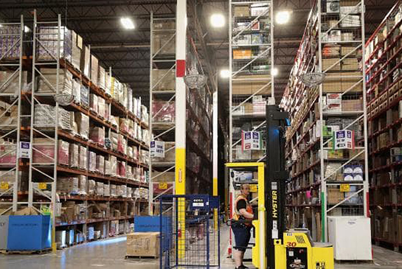 Workers pack and ship customer orders at an Amazon fulfilment centre in Romeoville, Illinois. Picture: AFP.
