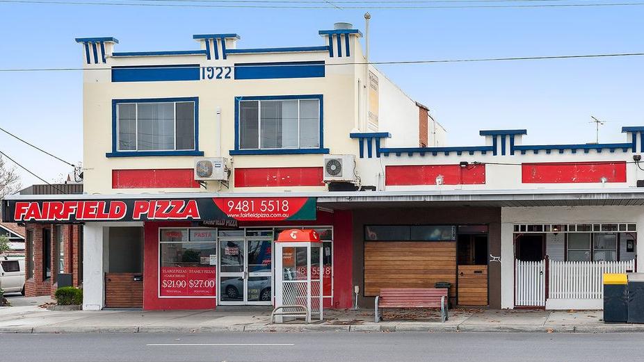 The corner pizza store, upstairs apartment and two residences are priced at almost $3 million.