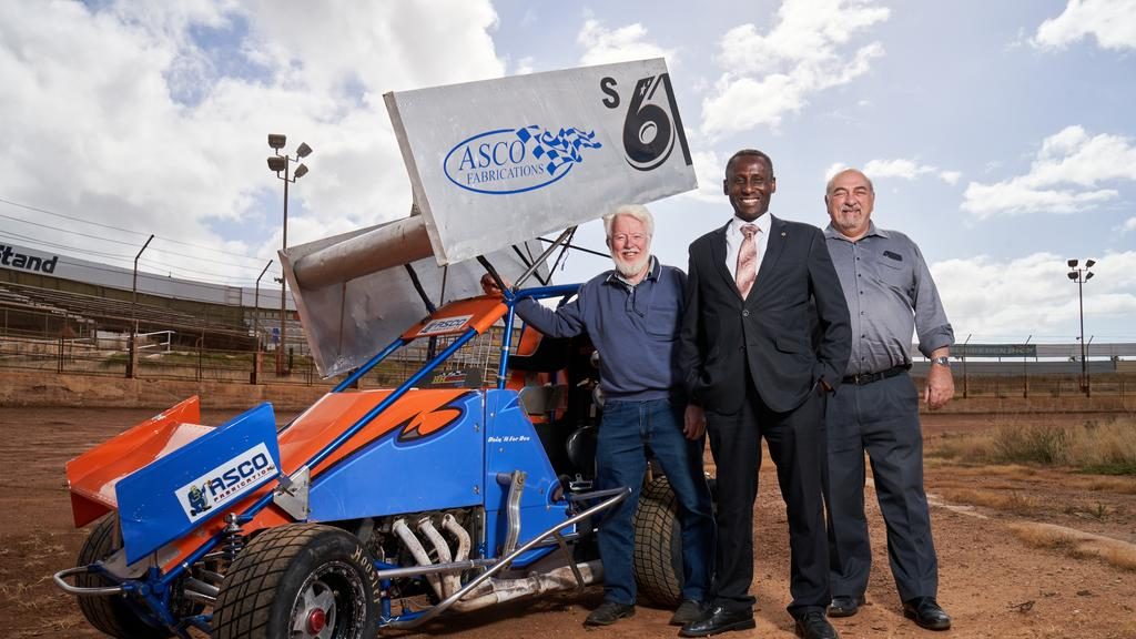 Speedway enthusiast Michael Buxallen and LJ Hooker real estate agents Stan Tettis and Kofi Adih at Speedway City. Picture: Matt Loxton.
