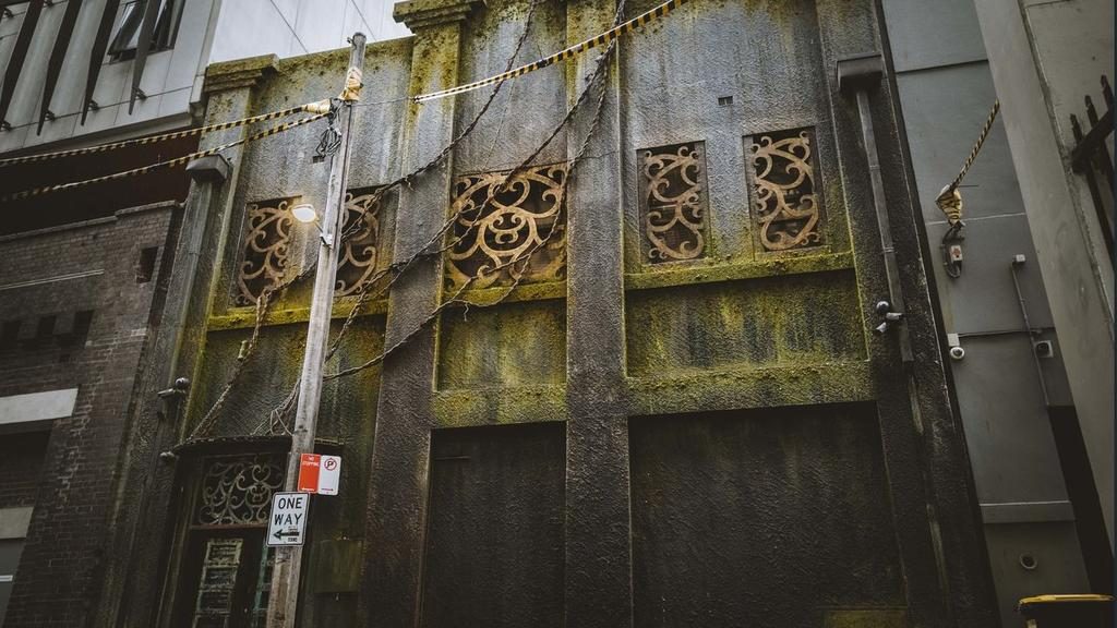 Hidden behind a huge wooden door, a Chippendale building housing the Saga Bar is on the market.