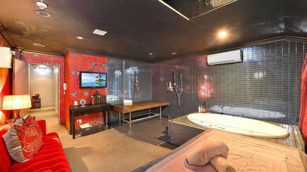 The three terraces housing an erotic massage parlour in Ultimo is on the market.