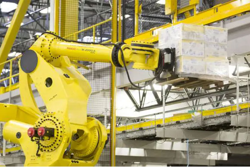 A robotic arm lifts a pallet of merchandise inside an Amazon Fulfilment Center in DuPont, Washington. Picture: Getty Images
