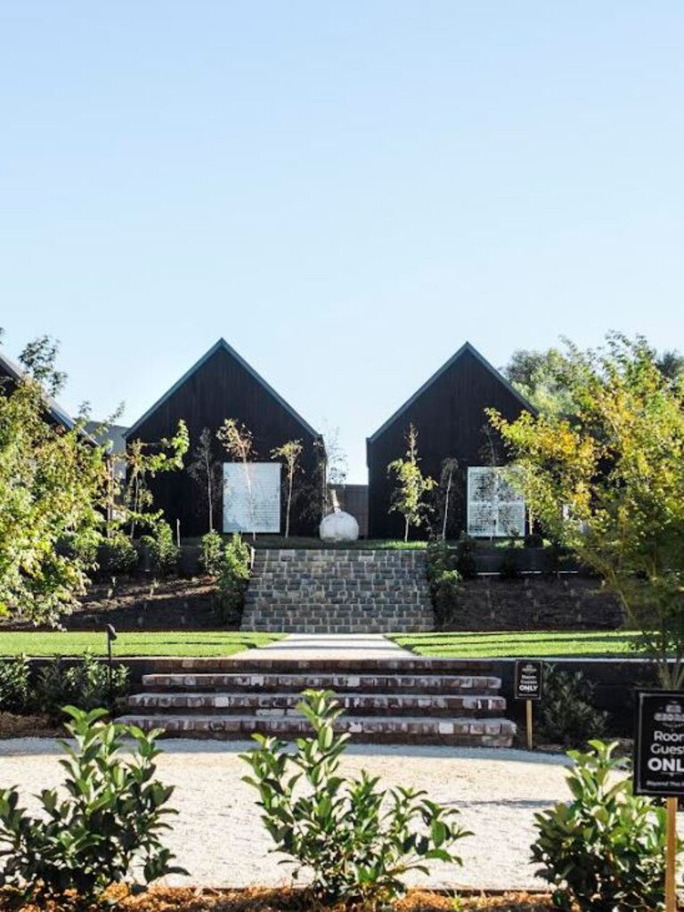 An exterior view of the stairs leading up to the farmhouses.