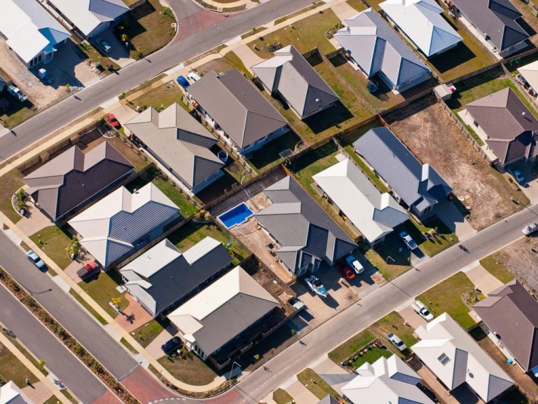 Bank, market economist diverge on housing price forecasts