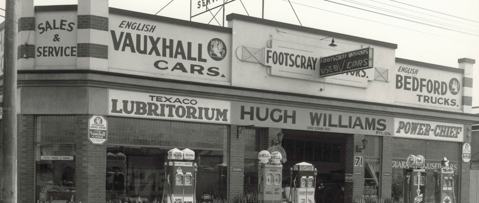 Footscray Motors circa 1930s. Note the multiple petrol brands at the one service station site. Picture: H.H. Paynting/ State Library of Victoria