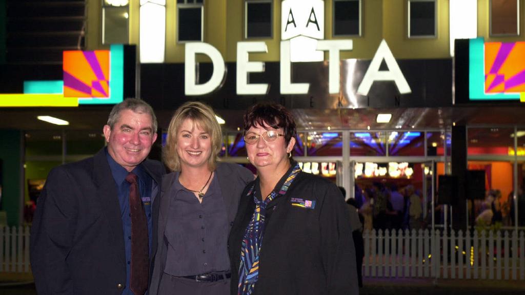 Golfer Karrie Webb (c) with Robert and Evelyn Webb standing in front of Burdekin Delta Cinema in Ayr 15 Dec 2000.