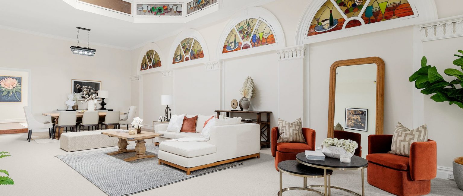A striking feature of the two street frontage building is its spacious ballroom style showroom, or large living and dining space. Picture: realcommercial.com.au/for-sale