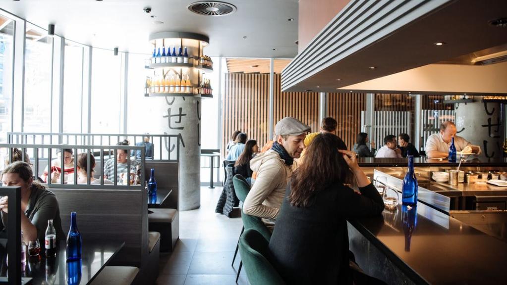 Customers enjoy some food at the Sekka restaurant.