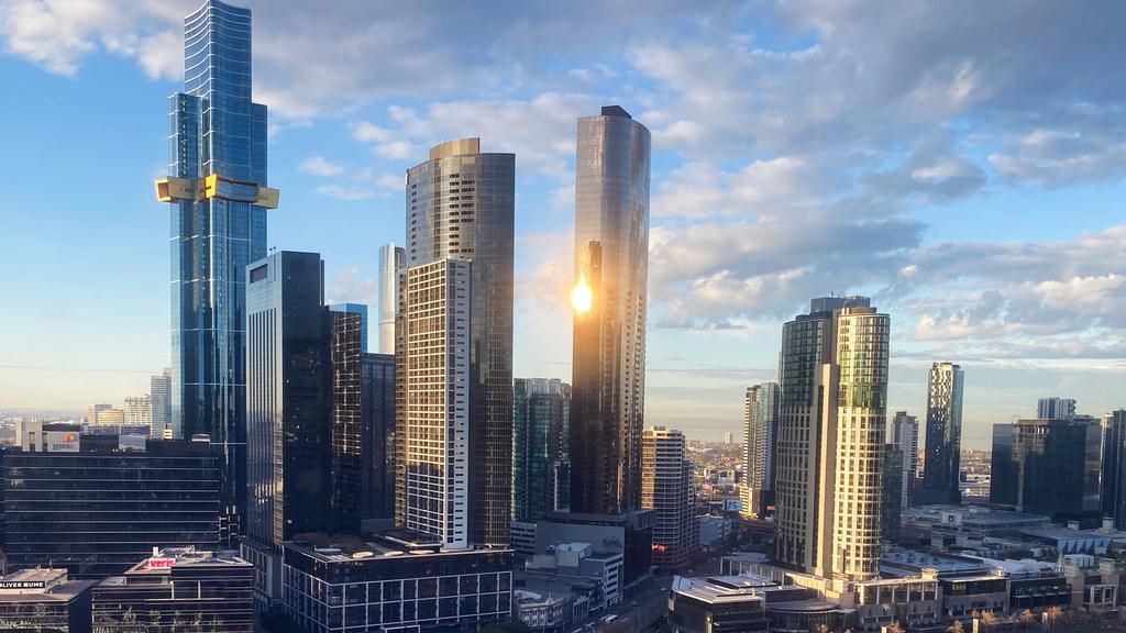 Melbourne with early morning light and a train