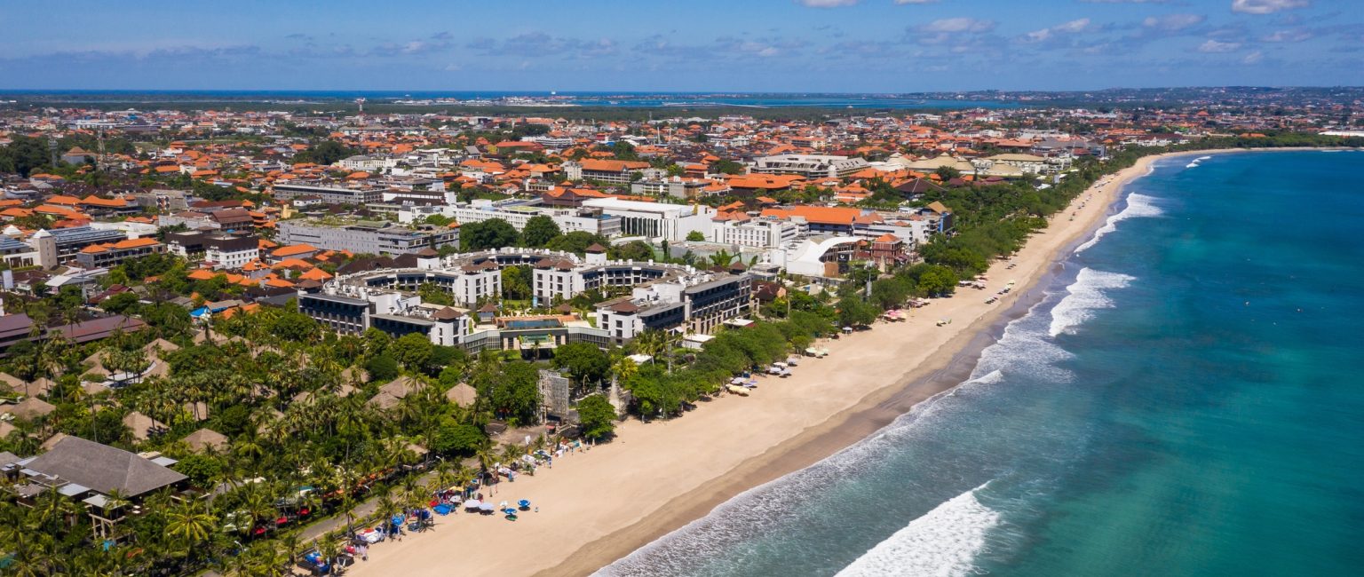Aerial view of the famous Kuta beach lined with luxury hotels in southern Bali in Indonesia, Southeast Asia
