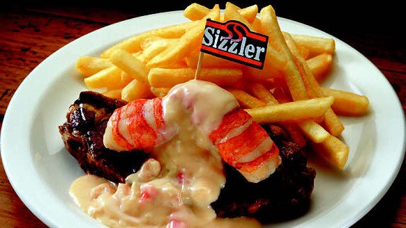 NOT FOR EDITORIAL USE - COPYRIGHTED FOR ADVERTORIAL USE ONLY ### SIZZLER's Gold Medal Combo meals -steak & lobster tails in seafood sauce chips food cafes restaurants recipes seafood meat - archived