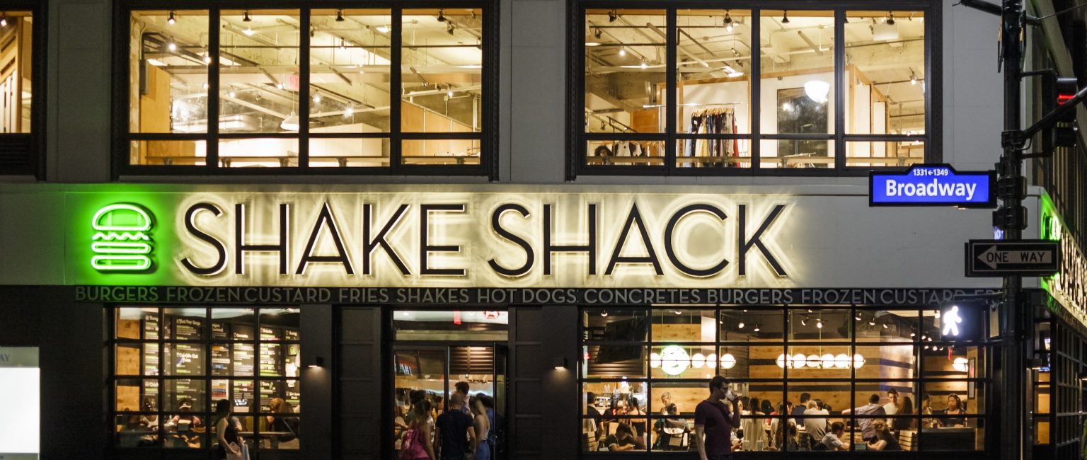 New York, New York, USA – July 15, 2016: Shake Shack near Herald Square in Manhattan. Shake Shack is a trendy food chain known for quality. People can be seen.
