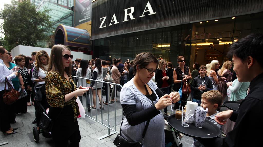 Hundreds of shoppers stand idle waiting to get into the Zara store at Westfield Pitt Street Mall in the Sydney CBD on the first official day of trading for the international store.