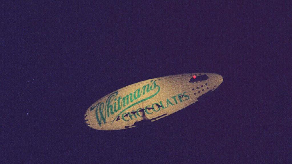 Whitman's Chocolates Lightship flying over Adelaide. airship whitmans /Airships