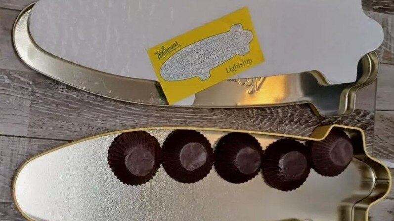 Supplied Real Estate Whitman's Chocolates Lightship Candy Tin from 1999 is for sale on
Ebay. It's been listed with a price guide of $42.78